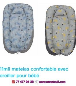 lit bébé avec oreiller